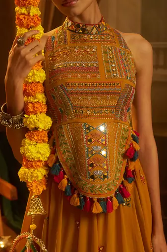 Mustard Yellow Georgette Lehenga with Hand Embroidered Halter Blouse and Tassel Shell Detail