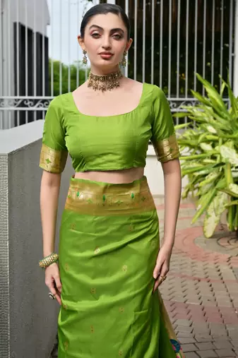 Parrot green soft banarasi silk blend paithani saree with rich zari & meena woven shiny pallu zari butties & tassels