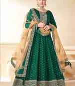 Green art silk sequins work semi stitched size up to 42 salwar suits