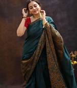 Elegance green woven pure silk gift saree with unstitched blouse