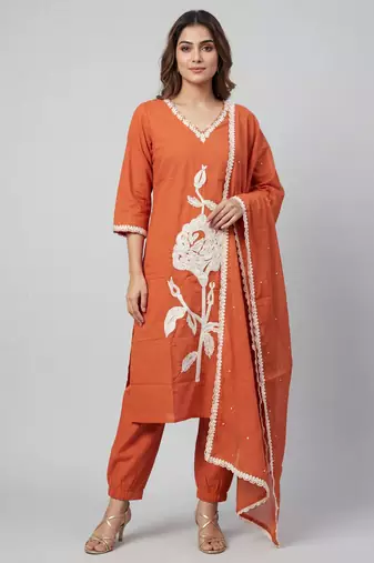 Women orange cotton printed kurta pant dupatta set with hand work and embroidered lace