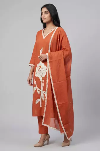 Women orange cotton printed kurta pant dupatta set with hand work and embroidered lace