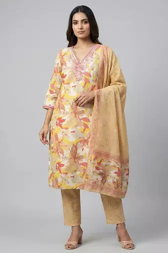 Women yellow cotton printed kurta pant dupatta set with hand work and embroidered lace