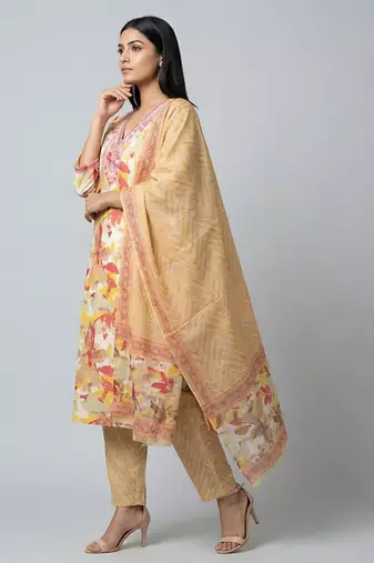 Women yellow cotton printed kurta pant dupatta set with hand work and embroidered lace