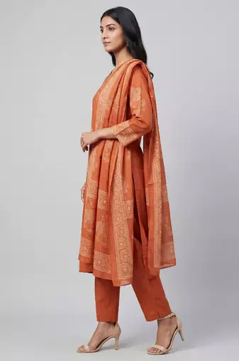 Women orange cotton printed kurta pant dupatta set with hand work