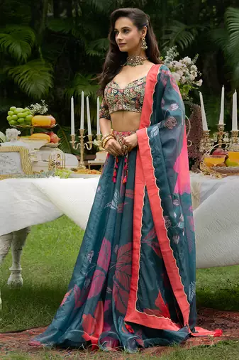 teal organza lehenga with printed floral designs