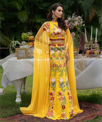 yellow viscose lehenga with embroidered floral designs 2