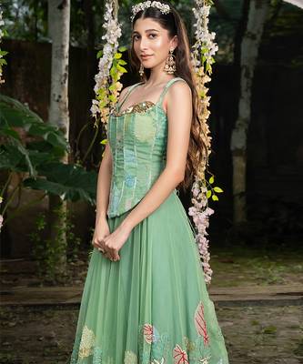 light green net lehenga with embroidered floral designs 1