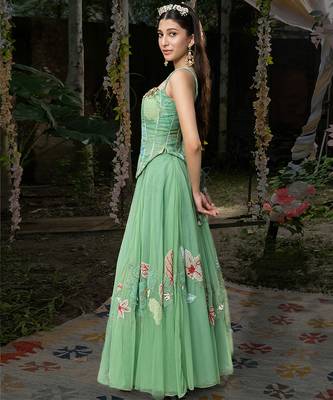 light green net lehenga with embroidered floral designs 2