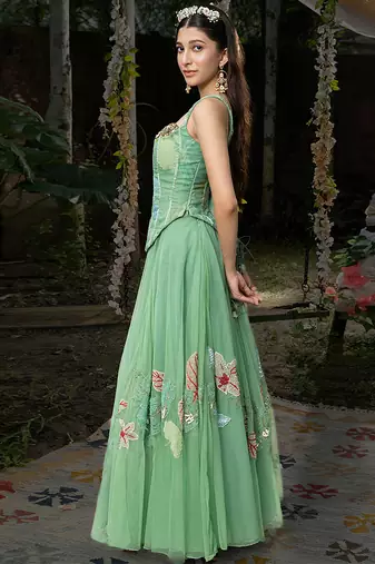 light green net lehenga with embroidered floral designs
