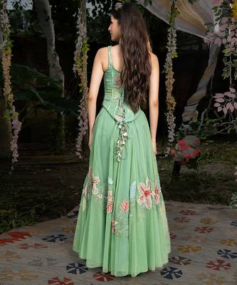 light green net lehenga with embroidered floral designs 3