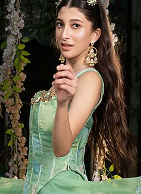 light green net lehenga with embroidered floral designs 4