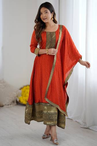 Orange women elegant blooming vichitra gown with jacquard lace border dupatta | party wear ethnic gown |