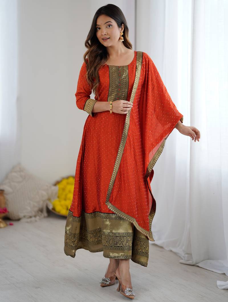 Orange women elegant blooming vichitra gown with jacquard lace border dupatta | party wear ethnic gown |