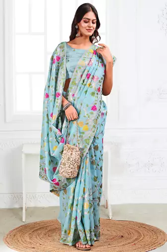 sky blue linen saree with woven multicolor leaf print
