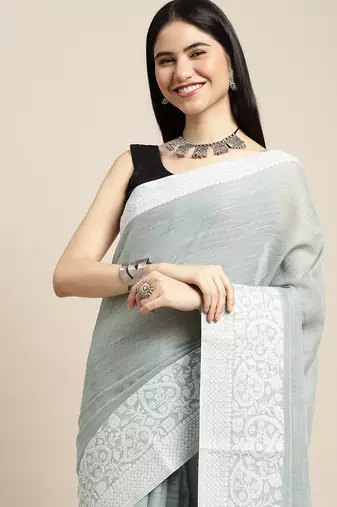 women teal green & silver-toned woven design linen blend saree