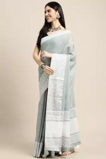 women teal green & silver-toned woven design linen blend saree