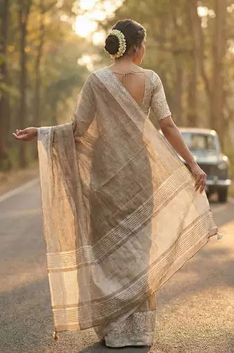 women beige & silver-toned woven design linen blend saree