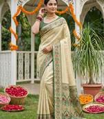 Sutriti elegant cream & green art silk kanjivaram style saree with rich zari border & paisley pallu
