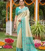 Sutriti elegant cream & turquoise art silk kanjivaram style saree with rich zari border & paisley pallu