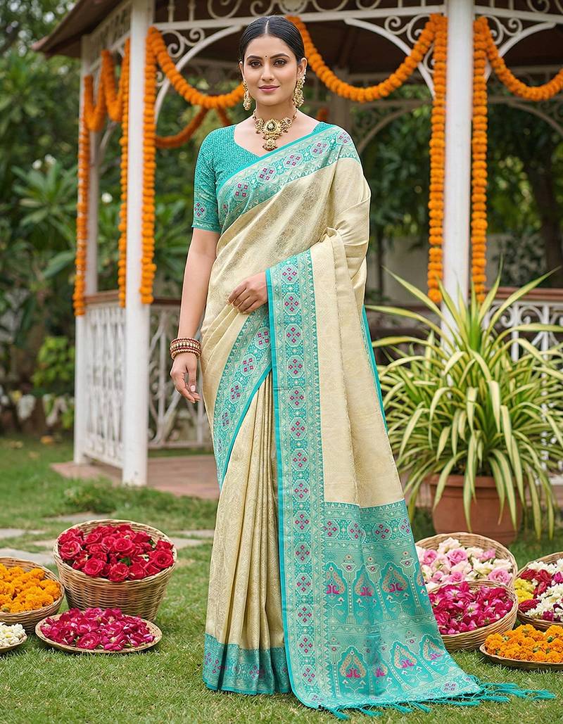 Sutriti elegant cream & turquoise art silk kanjivaram style saree with rich zari border & paisley pallu