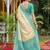 Sutriti elegant cream & turquoise art silk kanjivaram style saree with rich zari border & paisley pallu