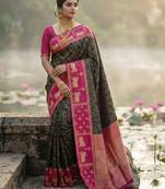 Sutriti women black soft silk saree with pink nandi zari temple border