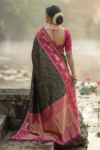 women black soft silk blend saree with pink nandi zari temple border