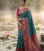 Sutriti women teal blue soft silk saree with pink nandi zari border