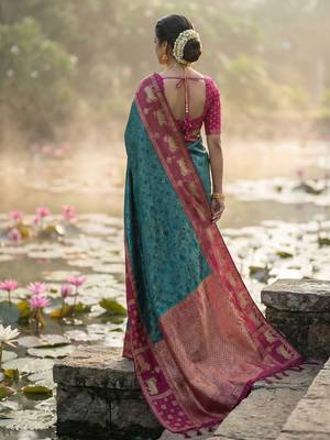 women teal blue soft silk blend saree with pink nandi zari border 4