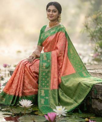 women peach soft silk blend saree with green nandi zari border 3