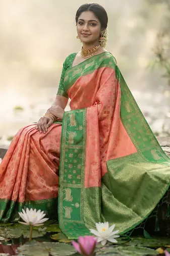 women peach soft silk blend saree with green nandi zari border