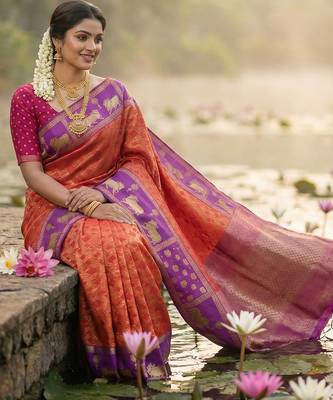 women rust orange soft silk blend saree with purple nandi zari border 3