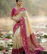 Sutriti women cream soft silk saree with pink nandi zari border