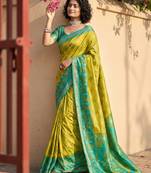 Sutriti mustard yellow & green pochampalli soft silk saree with traditional ikat pallu sari
