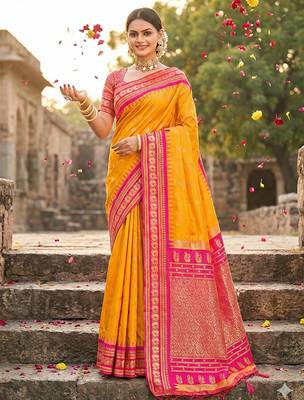 yellow banarasi silk blend saree with golden zari woven border 1