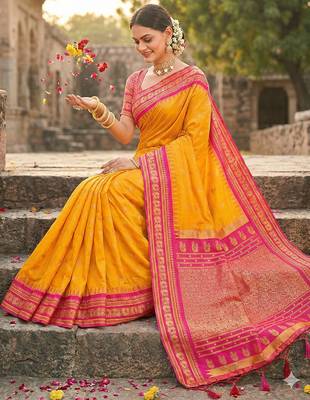 yellow banarasi silk blend saree with golden zari woven border 2