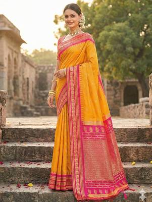 yellow banarasi silk blend saree with golden zari woven border 3