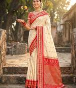 Sutriti graceful cream banarasi silk saree with golden zari woven border & floral jaal – wedding & festive wear