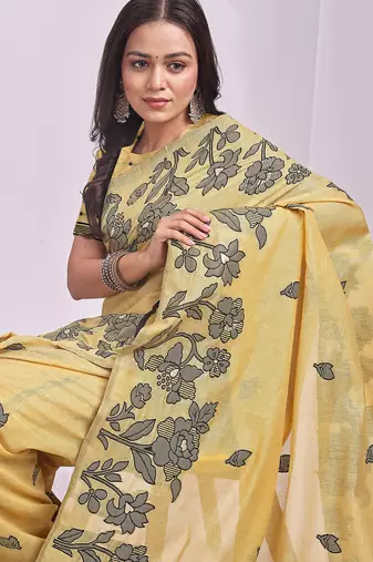 yellow linen saree with floral woven zari designs
