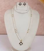 ivory pearl strand with deep navy floral pendant & matching studs