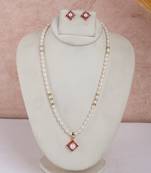 pearl necklace set with pink stone floral pendant design