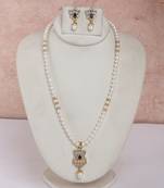 classic pearl necklace set with dark blue stone pendant accent