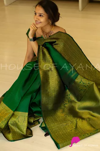Green silk blend banarasi saree with unstitched blouse piece