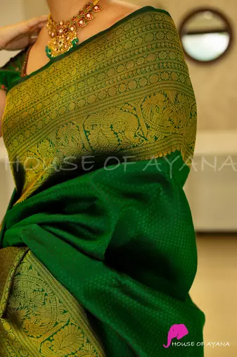 Green silk blend banarasi saree with unstitched blouse piece