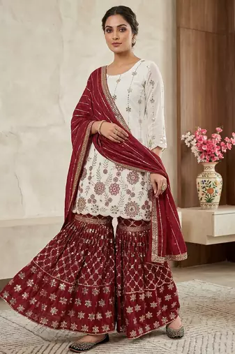 Heavy work white top with red sharara suit with dupatta