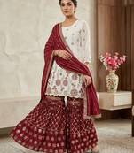 Heavy work white top with red sharara suit with dupatta
