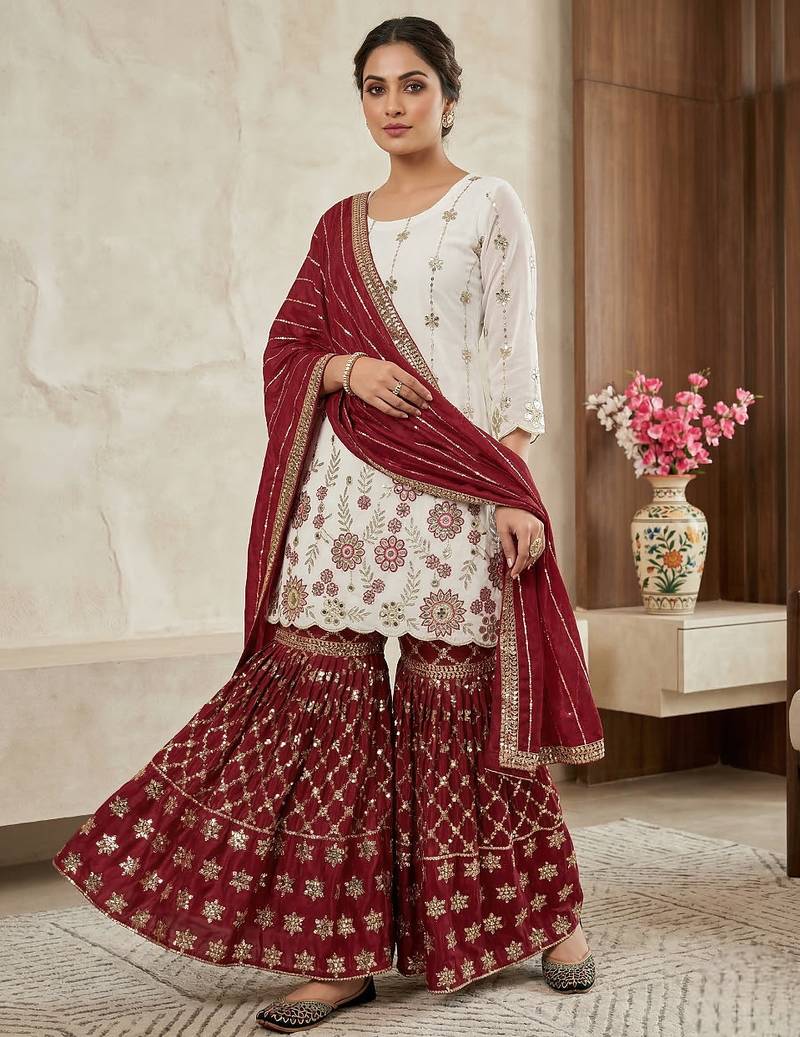 Heavy work white top with red sharara suit with dupatta
