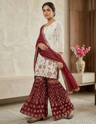 Heavy work white top with red sharara suit with dupatta 2
