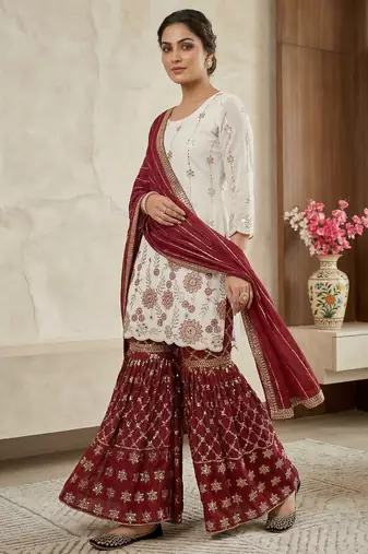 Heavy work white top with red sharara suit with dupatta